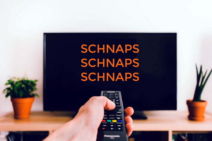 Fernsehschirm mit dreimaliger Aufschrift "Schnaps"