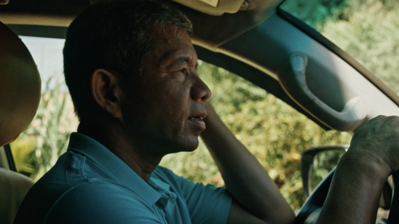 Yong Kim Eng am Steuer eines Autos.